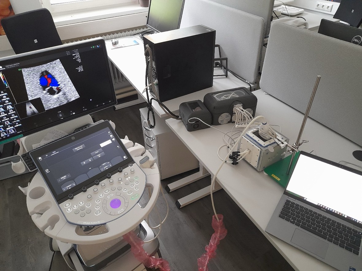 Complete simulator setup with pressure tank housing, valve unit, heart phantom, notebook and ultrasound system